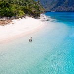 Couple on a tropical beach in El Nido, Palawan, Philippines